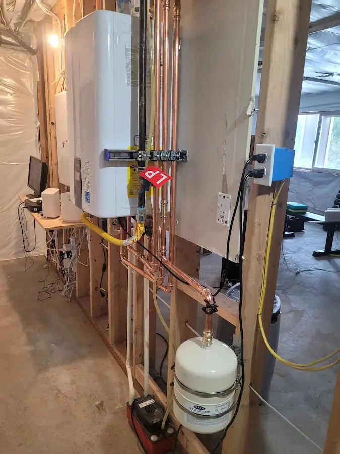 Licensed plumber repairing a kitchen sink in Jonesboro